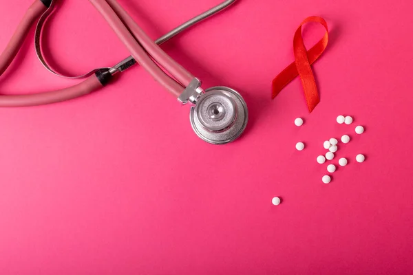 Directly Shot Red Aids Awareness Ribbon Medicines Stethoscope Pink Background — Stock Photo, Image