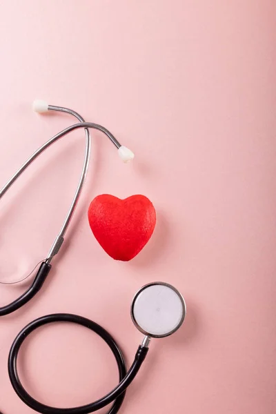 Overhead View Stethoscope Red Heart Shape Pink Background Copy Space — Photo