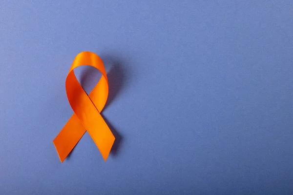 Directly Shot Orange Leukemia Awareness Ribbon Isolated Blue Background Copy — Fotografia de Stock