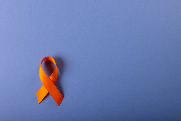 Directly Shot Leukemia Awareness Orange Ribbon Isolated Blue Background Copy — Stock Photo, Image