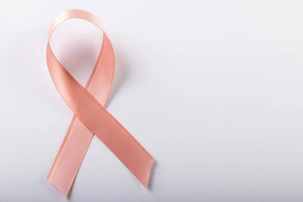 High Angle Close Pink Breast Cancer Awareness Ribbon Isolated White — Stockfoto