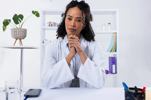 Portrait Confident African American Mid Adult Female Doctor Hands Clasped — Stok fotoğraf