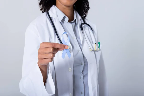 Midsection Female Doctor Holding Blue Stomach Cancer Awareness Ribbon Stomach — стоковое фото