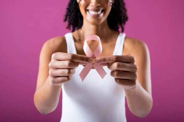Midsection Smiling African American Mid Adult Woman Holding Pink Breast — Foto de Stock