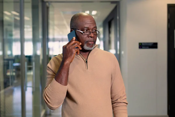 Bald African American Mature Businessman Talking Smartphone Walking Corridor Workplace — Stock Photo, Image