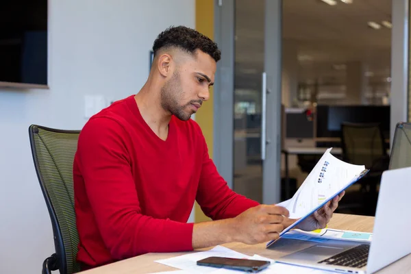 Hispanic Young Male Advisor Analyzing Document While Sitting Laptop Boardoom — Stock fotografie