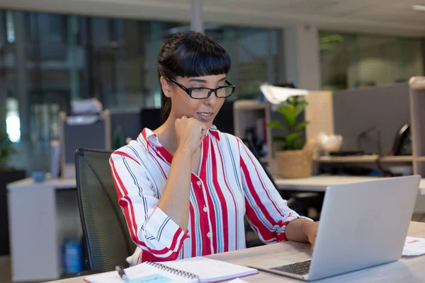 Young Biracial Businesswoman Contemplating While Looking Laptop Modern Workplace Unaltered — Stock Photo, Image