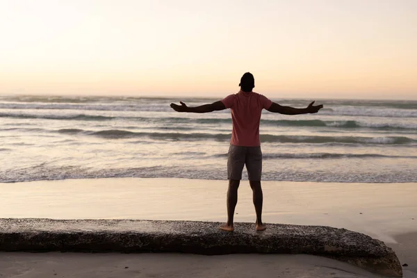 Rear View African American Young Man Arms Outstretched Standing Beach — Stock Photo, Image