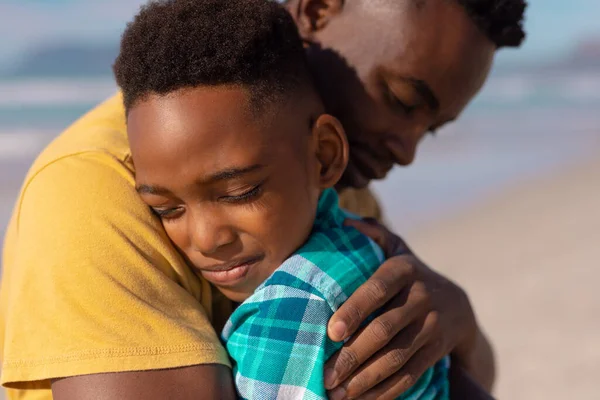 Close African American Boy Eyes Closed Embracing Young Father Beach — Foto de Stock