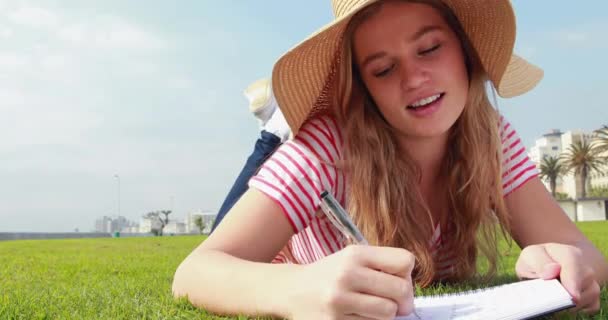 Pretty Young Student Lying Grass Studying Parkland — Stock Video