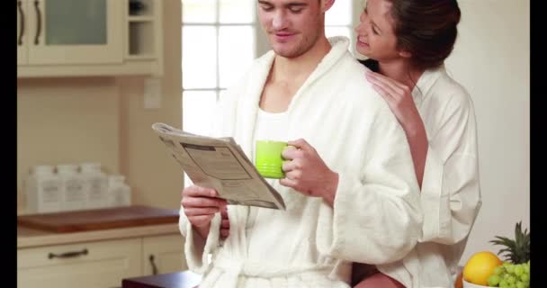 Happy Couple Reading Newspaper Together Kitchen — Stock Video