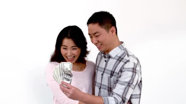 Happy Asian Couple Showing His Money White Background — Stock Video
