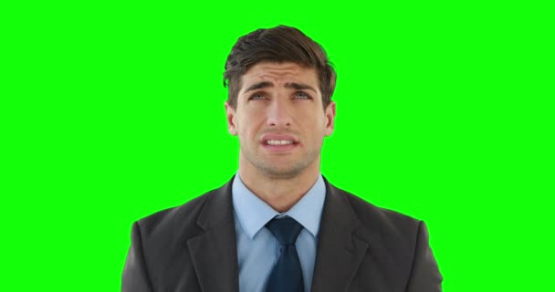 緑の背景に頭痛がしてきた青年実業家 — ストック動画
