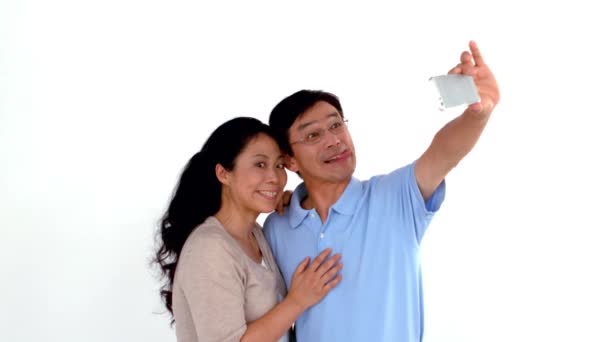 Couple Taking Selfie Grimacing White Background — Stock Video