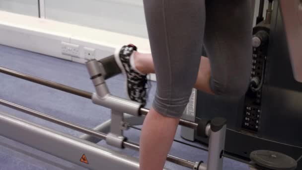 Woman Using Weights Machine Gym High Quality Format — Stock Video
