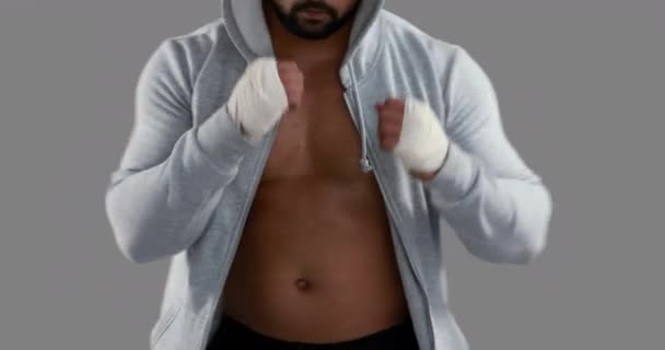 Muscular Man Wearing Grey Hood Grey Background — Stock Video