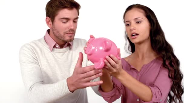 Poor Couple Moving Box Piggy Bank White Background Slow Motion — Stock Video