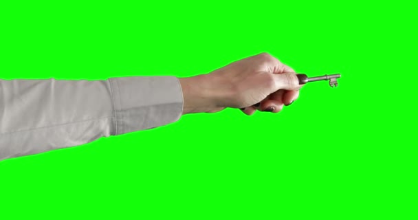 緑の背景に実業家回転キー — ストック動画