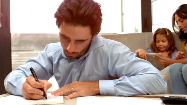 Hispanic Man Working While His Wife His Daughter Sofa Home — Stock Video