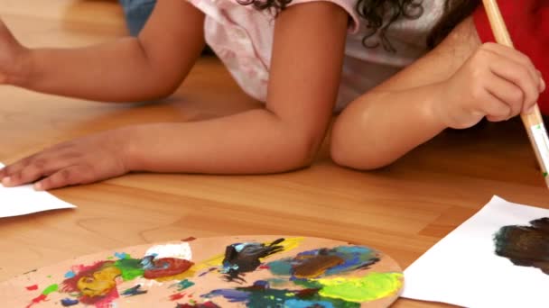 Girls Lying Floor Painting Slow Motion — Stock Video