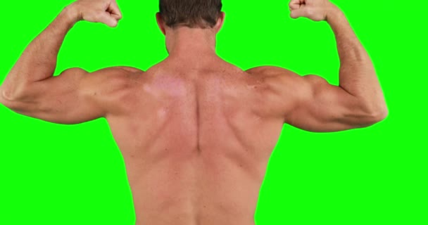 Мускулистый Человек Разминает Мышцы Зеленом Фоне — стоковое видео