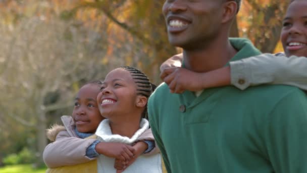 Happy Family Having Fun Together Kids Getting Piggy Backs — Stock Video