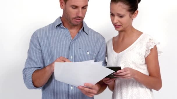 Stressed Couple Calculating Bills White Background Slow Motion — Stock Video