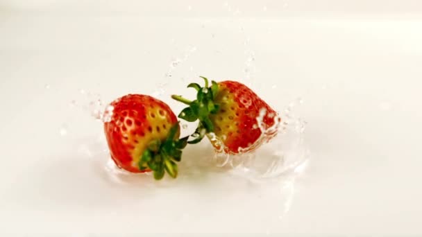 Close View Two Strawberries Falling Water — Stock Video