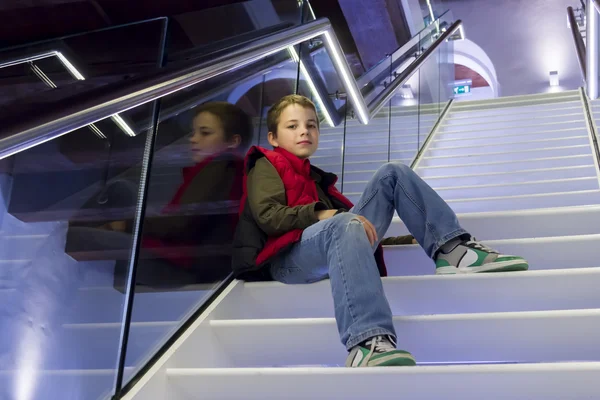 Portrait of teenage boy on the stairs — Stock Photo, Image