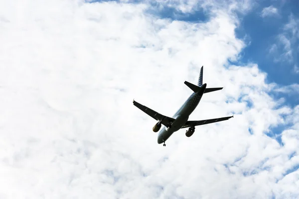 Airplane flying at blue sky — Stock Photo, Image