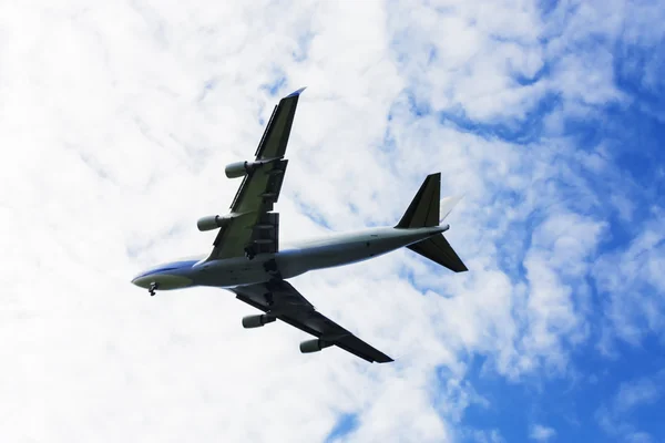 Airplane flying at blue sky — Stock Photo, Image