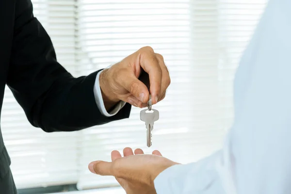 Real Estate Broker Manager Giving House Key Customer Signing Contract Stock Photo