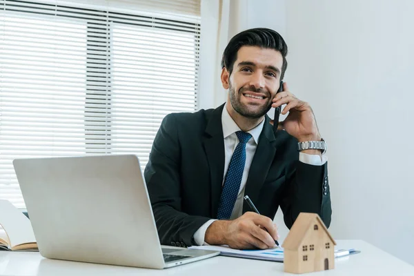 smart real estate agent professional making business call talking on mobile phone with customer for signing rental lease contract in office, home loan contract, buying house, real estate concept