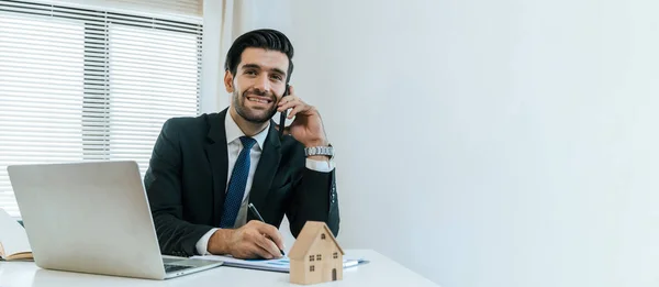 wide banner. real estate agent professional making business call talking on mobile phone with customer for signing rental lease contract in office, home loan, buying house, real estate concept