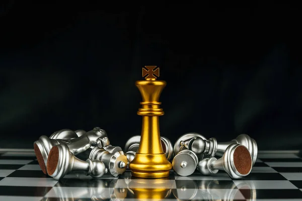 Teamwork. gold and silver chess pieces on chess board game competition on dark background, business finance, team leader, digital marketing, success, team leader and business strategy concept