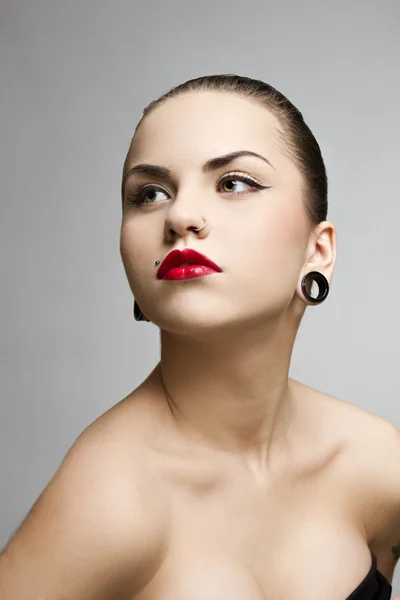 Beautiful girl punk with tattu, piercing, red lipstick and perfect skin — Stock Photo, Image