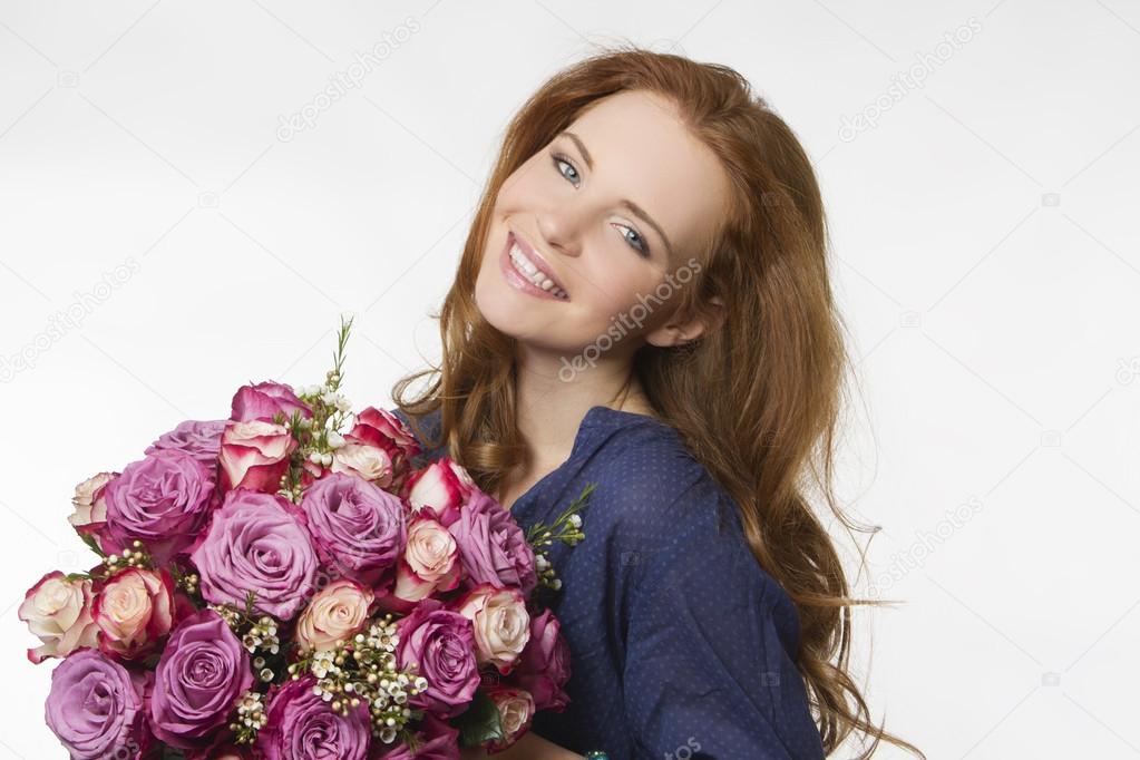beautiful smiling girl with a bouquet of flowers on a white background