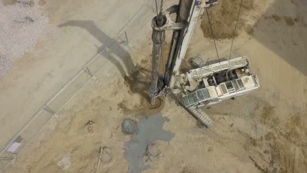 Aerial View Heavy Construction Equipment Digging Holes Construction Site — Stockvideo
