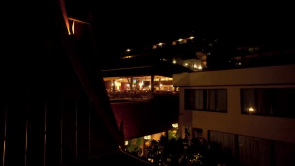 The night hotel is beautifully illuminated. — Stockvideo