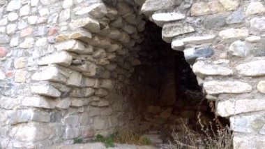 Stone castle, near the walls and inside.