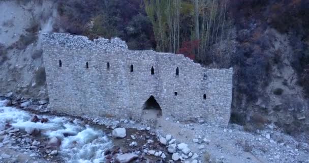 The stone castle on the banks of the river. — Stock video