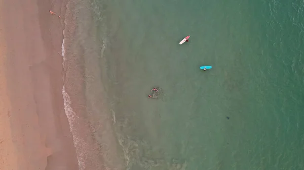 Top view of a group of surfers in the water. — Stockfoto