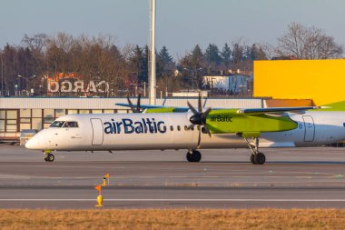 Gdansk, Poland - 07 April 2018: Aircraft line airBaltic, Bombardier Q400, landed on the Lech Walesa Airport in Gdansk. Flag carrier of Latvia.