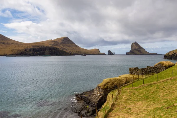 stock image View of the coast near Bour on the island of Vagar. Massive cliffs, crags hikes and ocean landscape. Bour on Vagar Island. Faroe Islands.