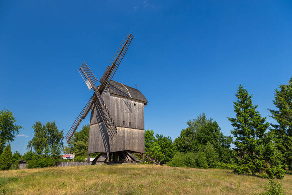 Wdzydze Kiszewskie - 31 May 2018: Dutch type windmill in open-air museum, Kashubian Ethnographic Park.