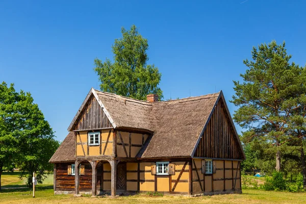 Thatched cottage in open-air museum, Kashubian Ethnographic Park. Wdzydze Kiszewskie, Poland.