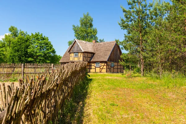 Thatched cottage in open-air museum, Kashubian Ethnographic Park. Wdzydze Kiszewskie, Poland.