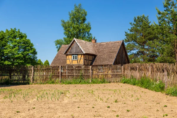 Thatched cottage in open-air museum, Kashubian Ethnographic Park. Wdzydze Kiszewskie, Poland.