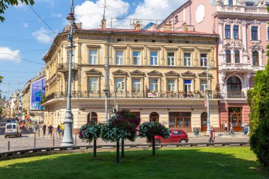 Lviv, Ukraine - 08 June 2018: Traditional buildings in a cobblestone street in historical Old town of Lviv.