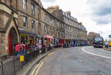 Edinburgh, Scotland, UK - 11 August 2018: Edinburgh street views, old town. People walking on the road. Edinburgh International Festival.